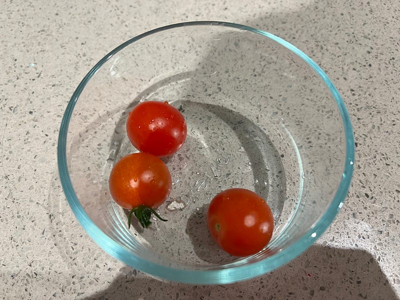 Cherry tomatoes being prepared for breakfast