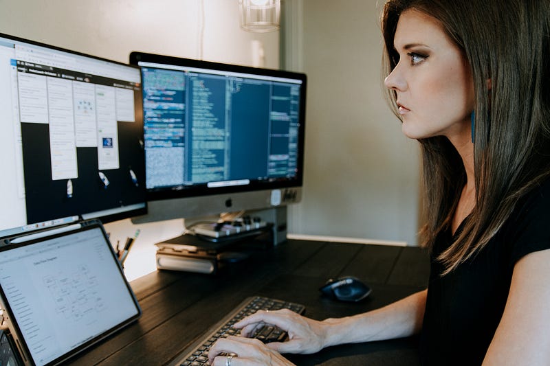 Female programmer working in a tech environment