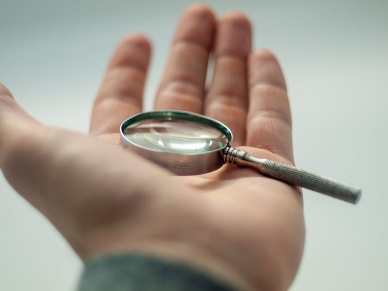 Magnifying glass focusing sunlight