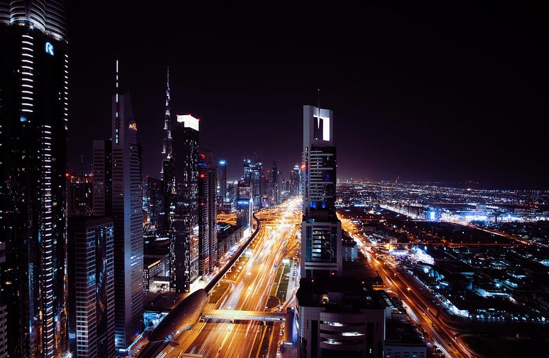 Futuristic city skyline at sunset