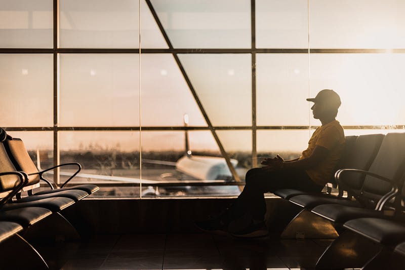 Passenger using a laptop on a plane