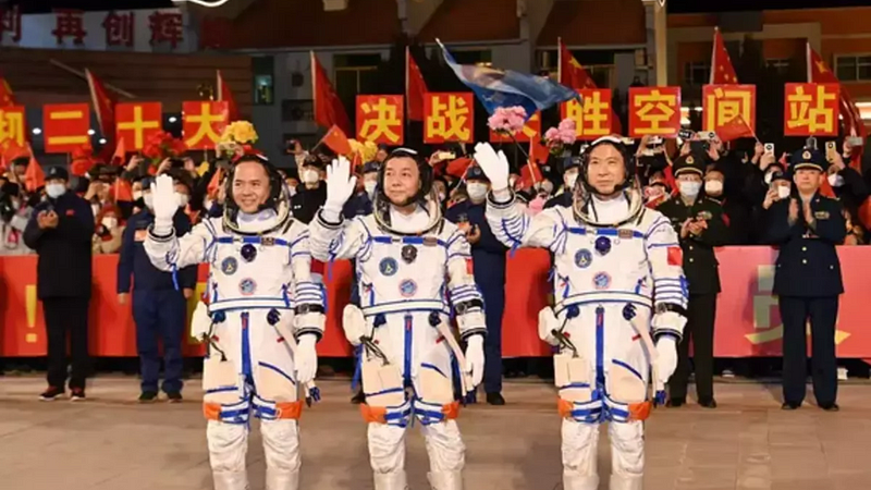 Chinese astronauts celebrating their successful mission return